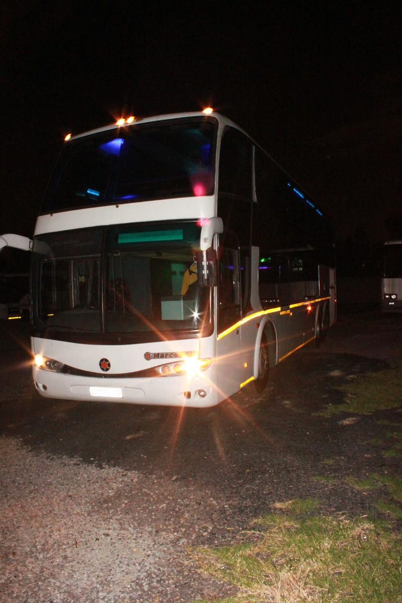 Party coach arriving at an evening event
