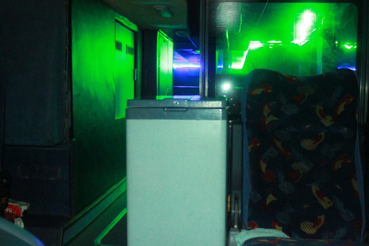 Onboard drinks fridge station inside a party bus