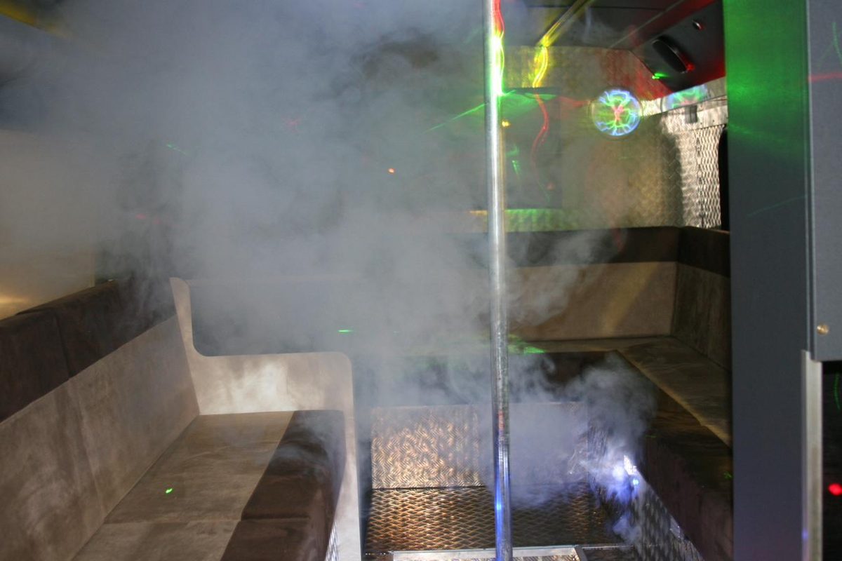 Atmospheric smoke and lighting inside a party bus